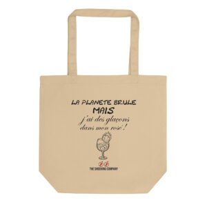 Éco tote bag beige avec design noir montrant la phrase « La planète brûle mais j’ai des glaçons dans mon rosé ! » et une planète en flammes dans un verre.