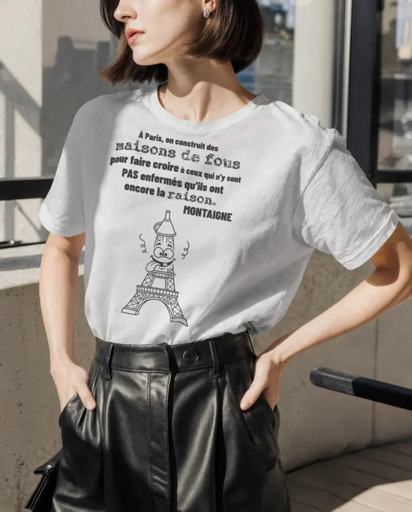 T-shirt blanc femme citation Montaigne "maisons de fous" avec illustration Tour Eiffel caricaturée - The Shocking Company