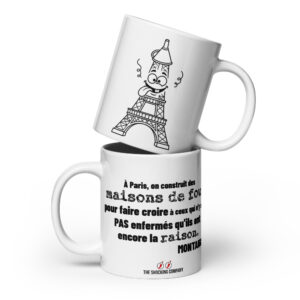 Tasse avec citation de Montaigne sur Paris et illustration d’une tour Eiffel folle aux yeux exorbités et à la langue tirée.